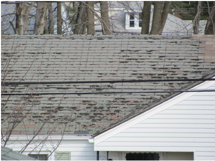Roof with visible signs of aging 3-tab asphalt shingles